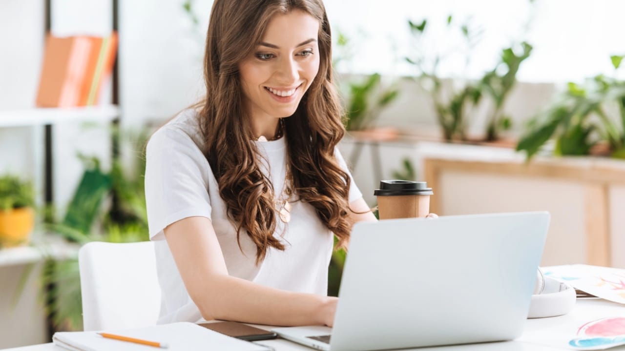 12 Unexpected Reasons Why People are Fleeing California - young woman with laptop working from home dp266798830