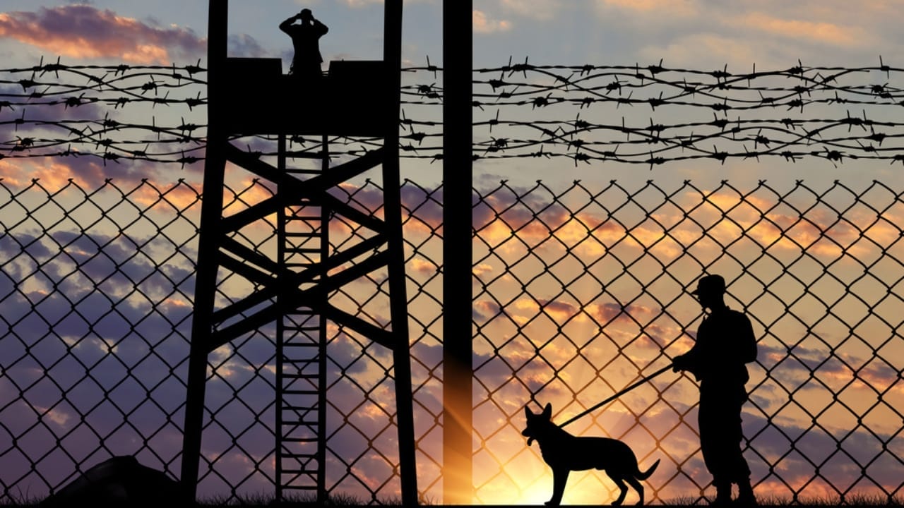 Inmates & Shelter Dogs Find Redemption Through PAWS Program 3 Inmates & Shelter Dogs Find Redemption Through PAWS Program - a guard with a dog ss320672750