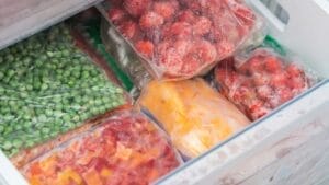 15 Common Foods You Should Stop Putting in Your Freezer 1 15 Common Foods You Should Stop Putting in Your Freezer - bags with frozen vegetables in refrigerator ss2080084744