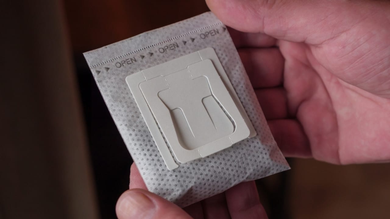 Coffee Filters in Plant Pots... Here's Why It Works 5 Coffee Filters in Plant Pots... Here's Why It Works - man hand holding drip filter coffee bag ss2470664857