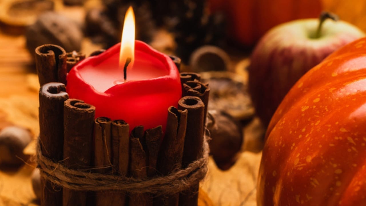 Fall Decor on a Budget: 18 Creative Ways to Keep Your Space Warm & Inviting 3 Fall Decor on a Budget: 18 Creative Ways to Keep Your Space Warm & Inviting - orange candle with cinnamon pumpkin dp402188266