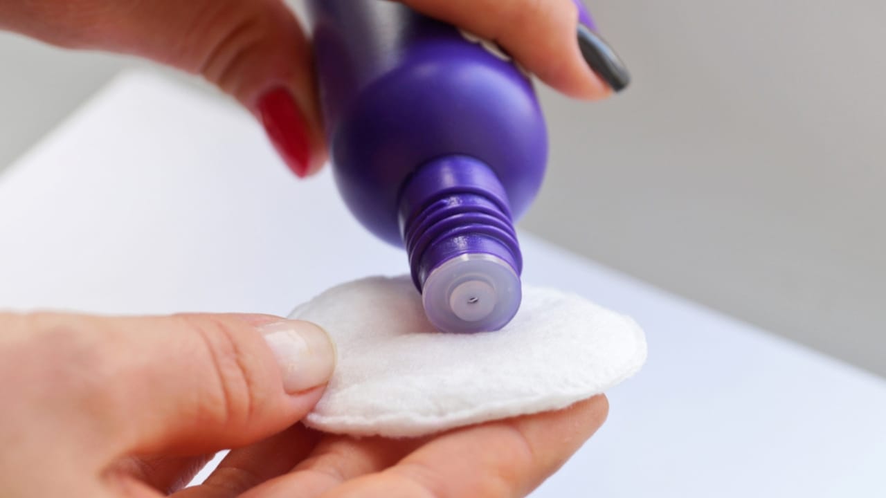 Stop Storing These 15 Things in the Bathroom—Here’s Why 15 Stop Storing These 15 Things in the Bathroom—Here’s Why - pouring nail polish remover ss1032464908