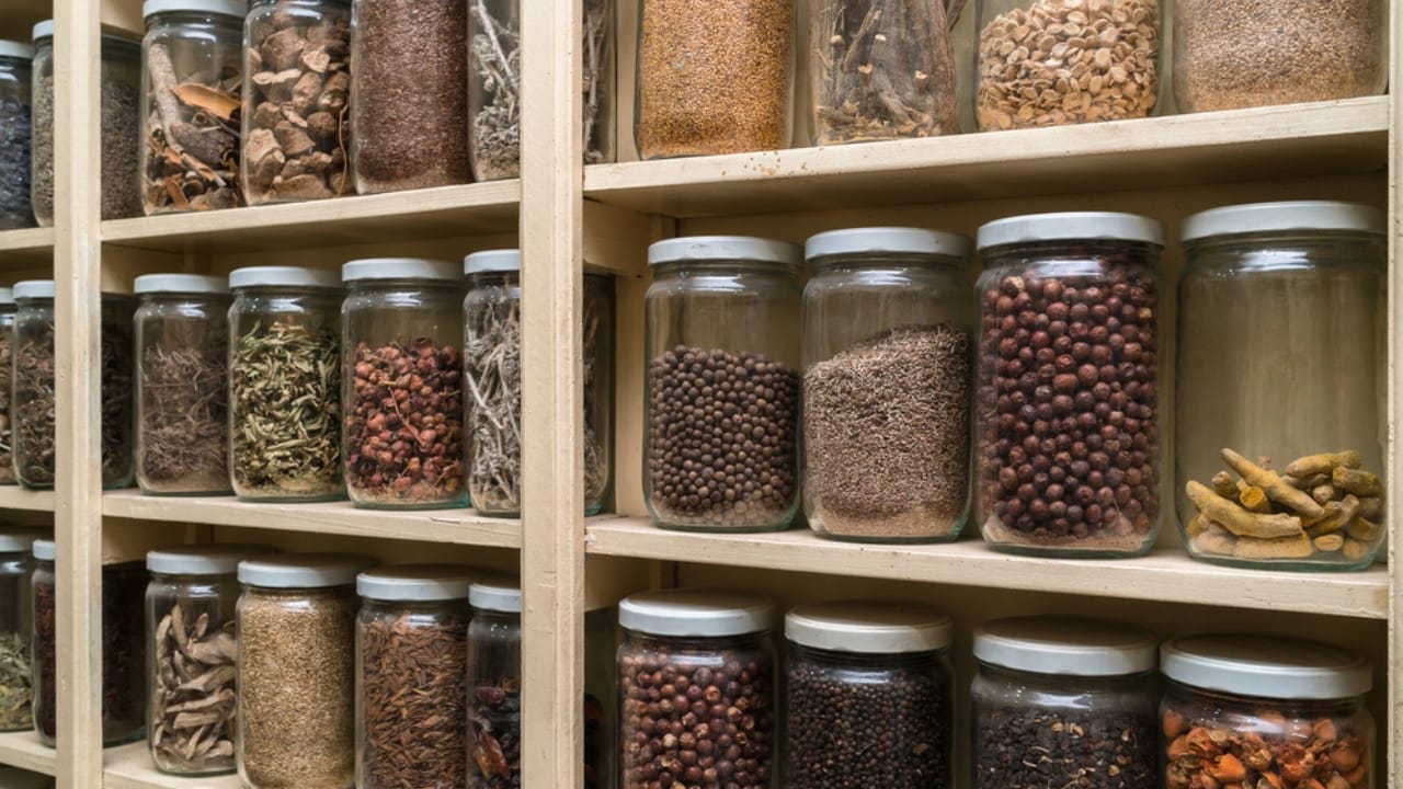 13 Countertop Items to Ditch for a Sleeker, Designer-Approved Kitchen 10 13 Countertop Items to Ditch for a Sleeker, Designer-Approved Kitchen - spices glass container in kitchen dp144444583