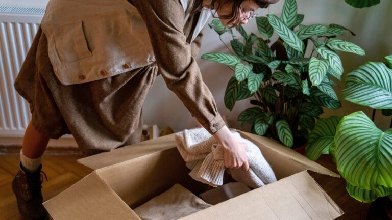 Declutter These 12 Overlooked Items to Instantly Maximize Your Home's Space 6 Declutter These 12 Overlooked Items to Instantly Maximize Your Home's Space - woman declutter ss2317929727