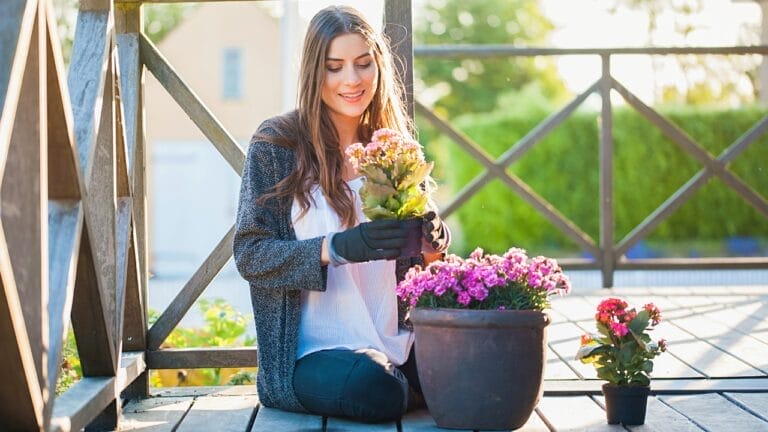 12 Perfect Patio Plants to Grow in Pots for a Lush Outdoor Oasis - woman patio plants ss1140557156