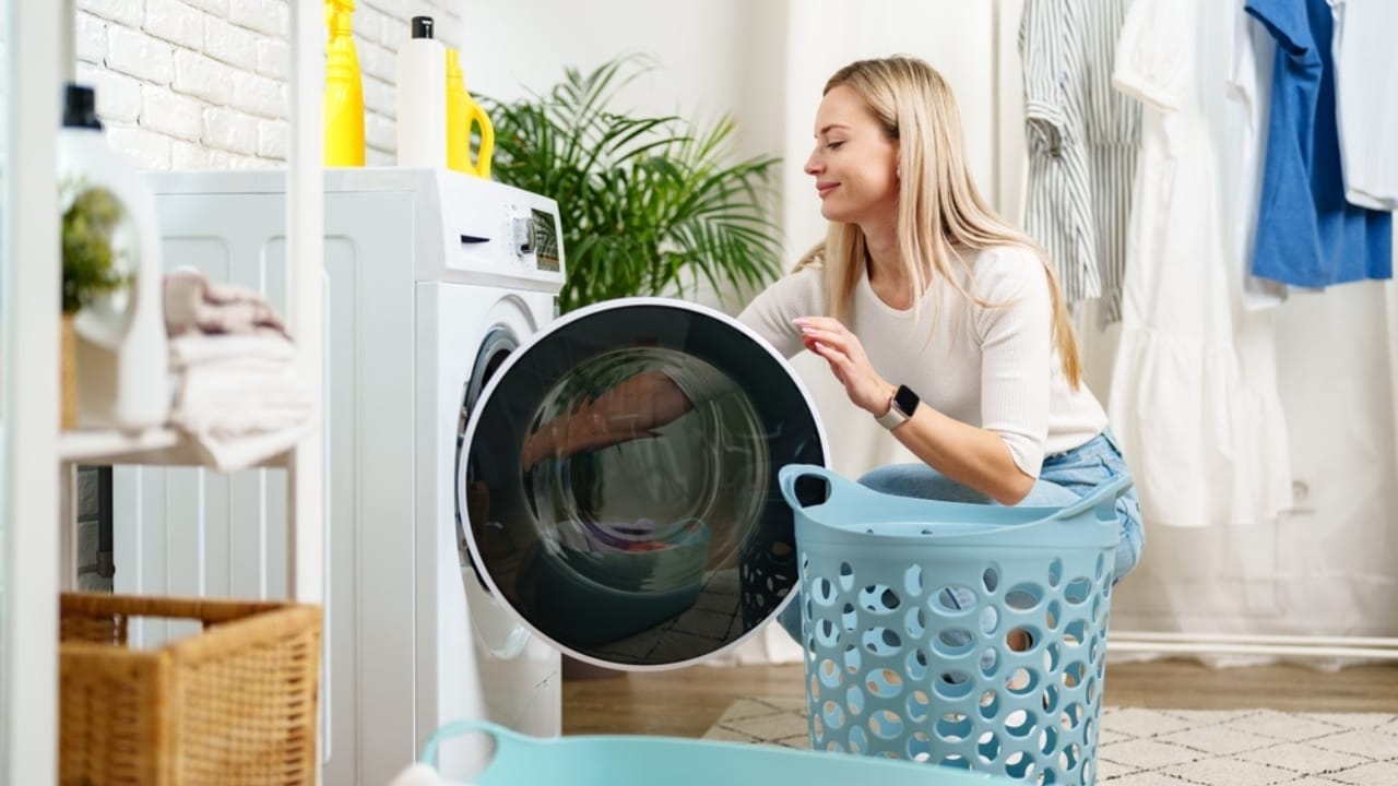 8 Household Chores That Show How Far We've Come 2 8 Household Chores That Show How Far We've Come - woman doing laundry washing machine ss2483386377
