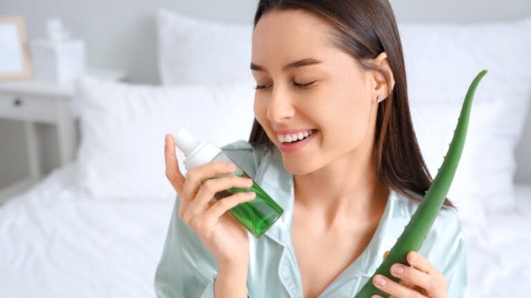 Aloe Vera for the Win: Why This Plant Should Be in Every Home 6 Aloe Vera for the Win: Why This Plant Should Be in Every Home - woman holding aloe vera and bottle of cosmetic product ss2495985285