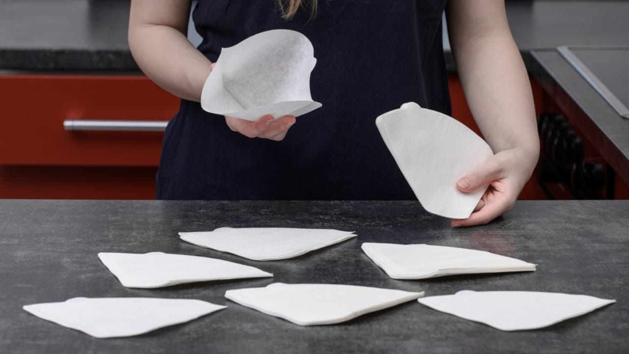 Coffee Filters in Plant Pots... Here's Why It Works 4 Coffee Filters in Plant Pots... Here's Why It Works - woman holding coffee filters ss2508841111