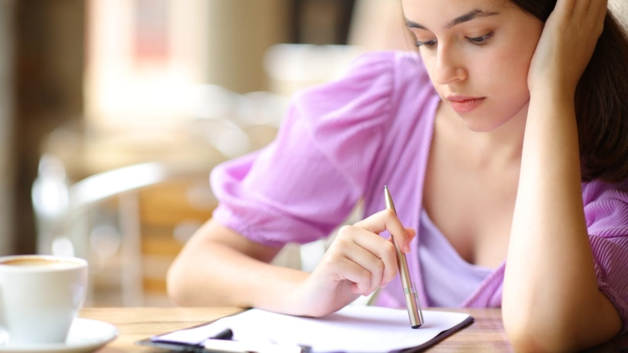 6 Simple Steps to Start Homesteading on a Budget 7 6 Simple Steps to Start Homesteading on a Budget - woman thinking before signing contract ss2343312741