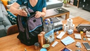 16 Affordable Survival Items That Will Serve You Well in an Emergency 1 16 Affordable Survival Items That Will Serve You Well in an Emergency - woman with bag ss2000875694