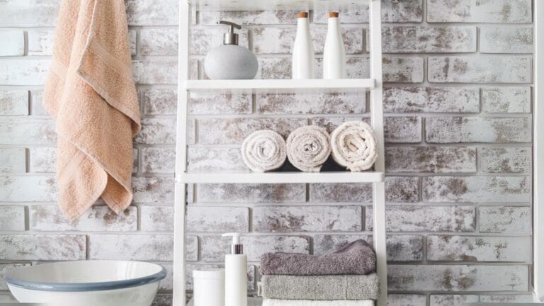 18 Bathroom Organization Hacks to Declutter Your Space 3 18 Bathroom Organization Hacks to Declutter Your Space - Clean towels with cosmetics on shelves dp320711788
