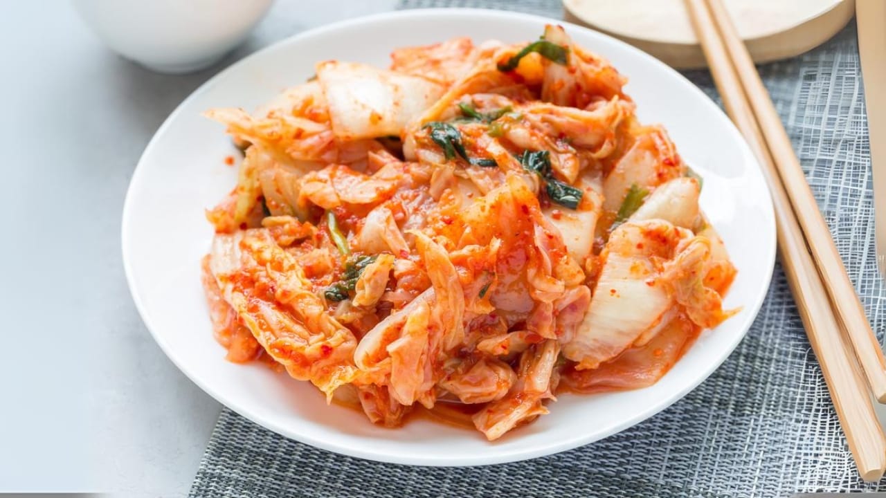 15 Wallet-Friendly Sources to Get Your Probiotics without Supplements - Kimchi in plate dp377642126