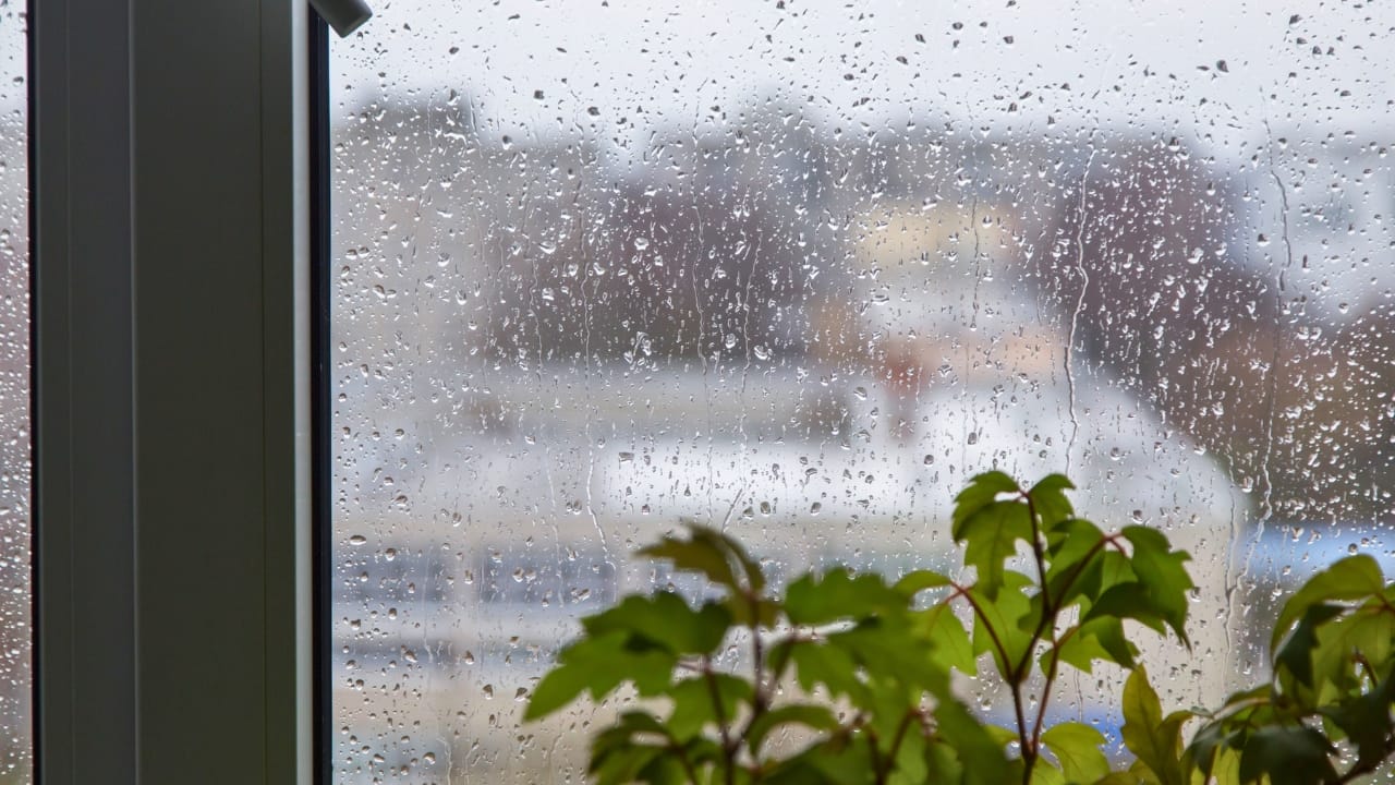 15 Easy Winterization Tips to Protect Your Home & Wallet - Rain drops on window glass close ss2460627203 degm