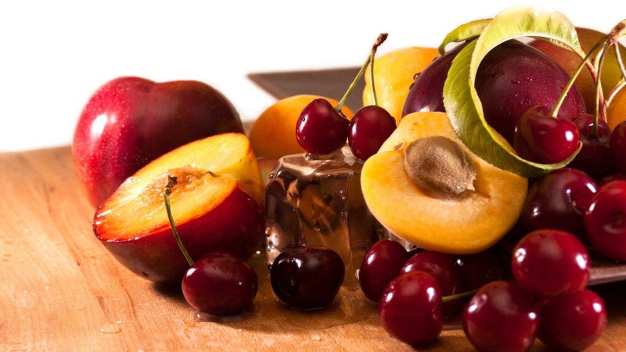 20 Regular Foods That Can Turn Deadly for Your Dog 18 20 Regular Foods That Can Turn Deadly for Your Dog - Summer fruits peaches plums dp37242893