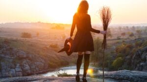 Craft Your Own Magical Halloween Witches' Broom: 2 Free DIY Methods 1 Craft Your Own Magical Halloween Witches' Broom: 2 Free DIY Methods - Woman in a witch costume ss730129138