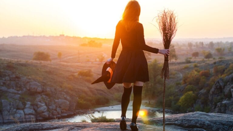 Craft Your Own Magical Halloween Witches' Broom: 2 Free DIY Methods - Woman in a witch costume ss730129138