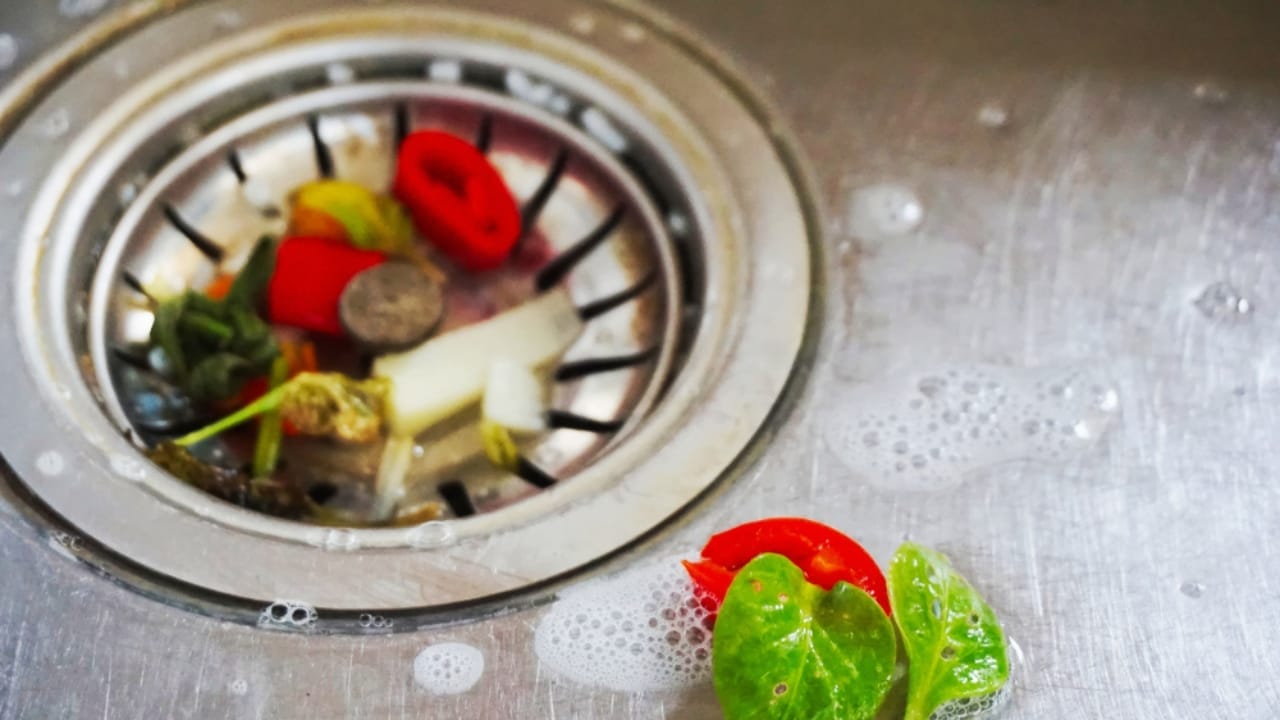 Kitchen Sink Odors? Here’s What’s Causing Them & How to Get Rid of It - food debris sink ss1201724491