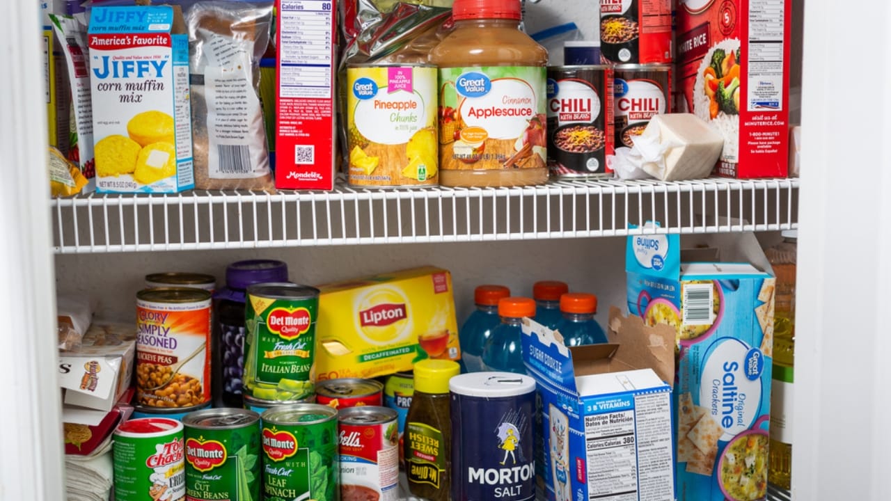 10 Things You Should Never Store in Low Kitchen Cabinets - food in pantry dp553642528