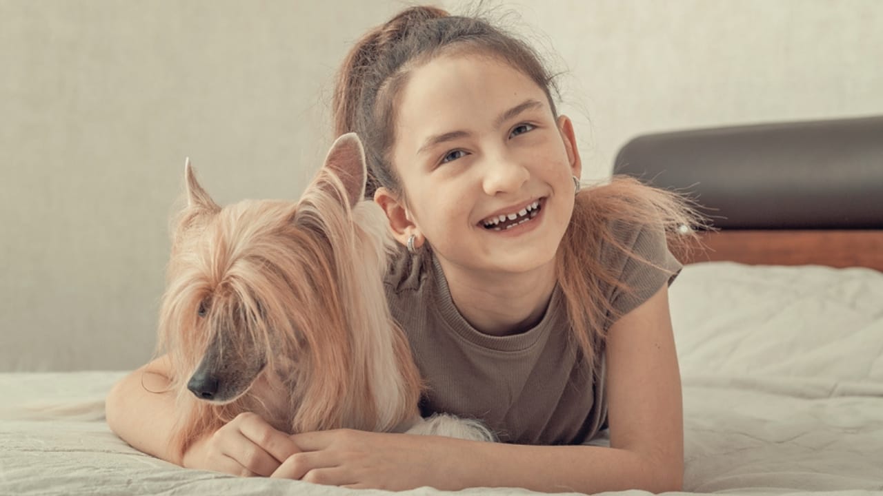 15 Common Habits Your Dog Secretly Wishes You’d Stop Doing 8 15 Common Habits Your Dog Secretly Wishes You’d Stop Doing - girl with chinese crested dog ss1945665259