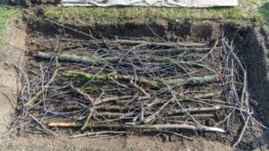 Turn Yard Waste into a Thriving Garden with Hugelkultur 1 Turn Yard Waste into a Thriving Garden with Hugelkultur - hugelkultur raised beds twigs logs ss1689226687