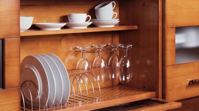 10 Things You Should Never Store in Low Kitchen Cabinets - kitchen cabinet with glass dp620749672