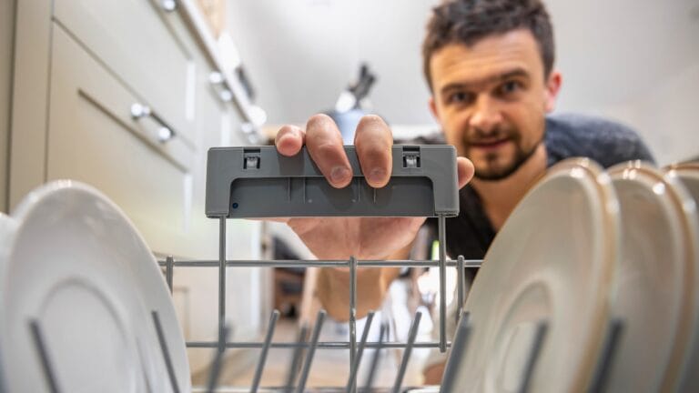 Silverware Up or Down? The Best Way to Load Your Dishwasher Safely - man dishwasher ss2022201791