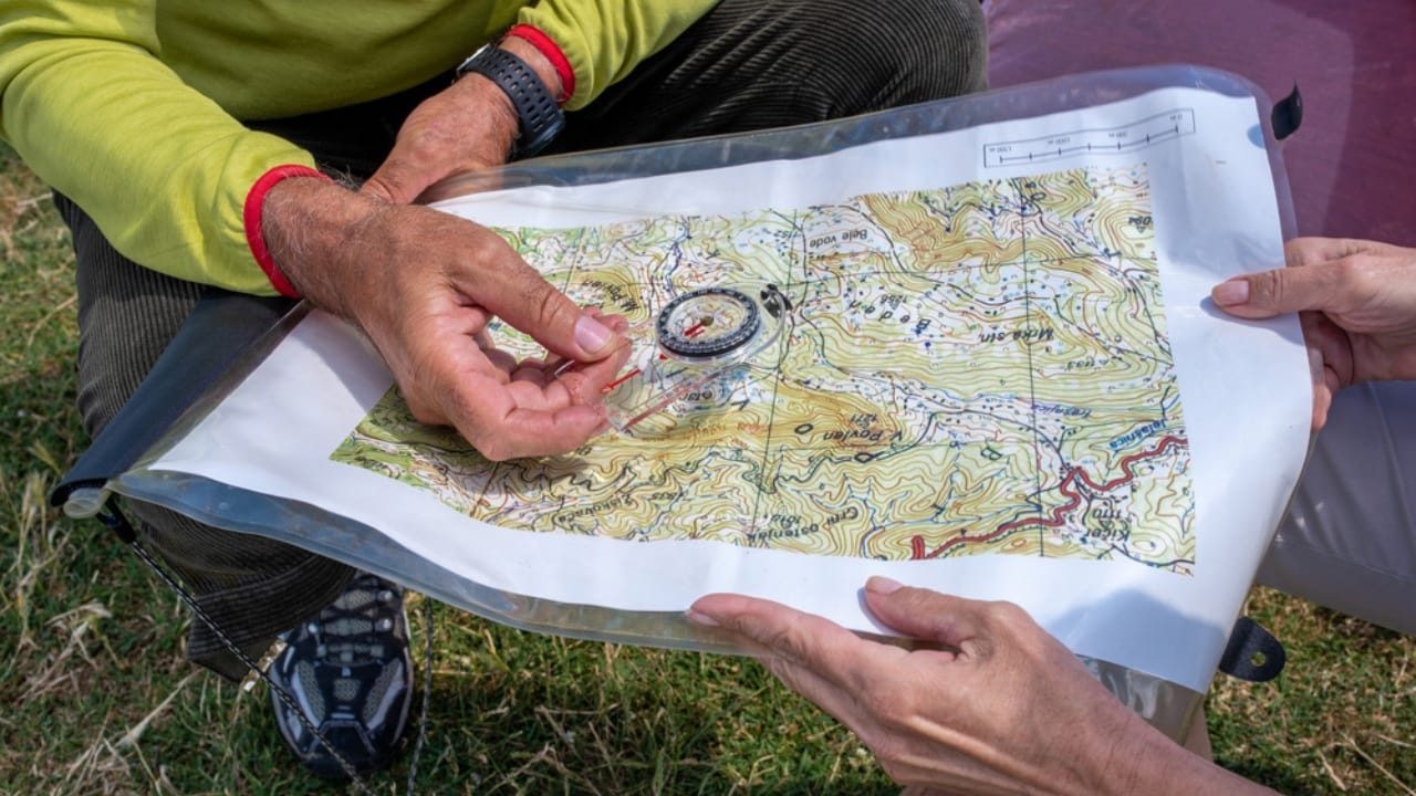 21 Lost Pioneer Skills That Few People Know Today - man and woman reading Topographical Map ss1835178121