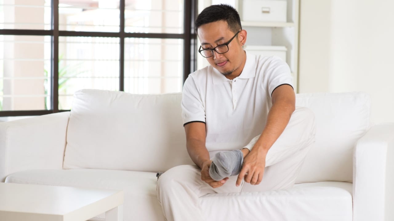 8 Ways a Bay Leaf in Your Socks Can Boost Your Day - man wearing socks dp83859514
