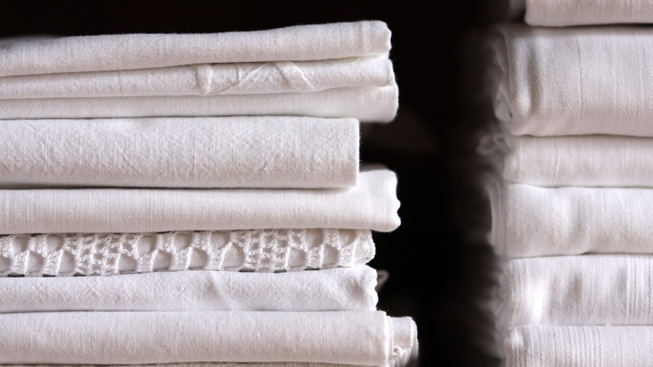 Millennial Minimalism: 15 Things to Let Go of in Your 30s 5 Millennial Minimalism: 15 Things to Let Go of in Your 30s - pile of bed sheets dp26331461