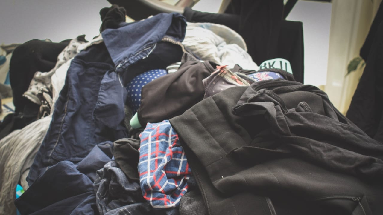 15 Things You Should Never Store in Your Garage 9 15 Things You Should Never Store in Your Garage - pile of clothes ss1081394486