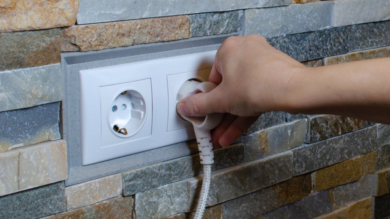 Prepping for Power Outages: 30 Important Steps to Stay Safe & Comfortable 11 Prepping for Power Outages: 30 Important Steps to Stay Safe & Comfortable - plugging unplugging dp437034562