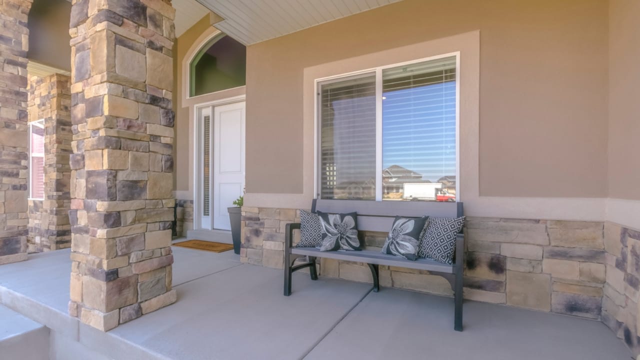 8 Ways to Make Your Porch a Welcoming Outdoor Escape 9 8 Ways to Make Your Porch a Welcoming Outdoor Escape - porch with bench and pillows dp206143046