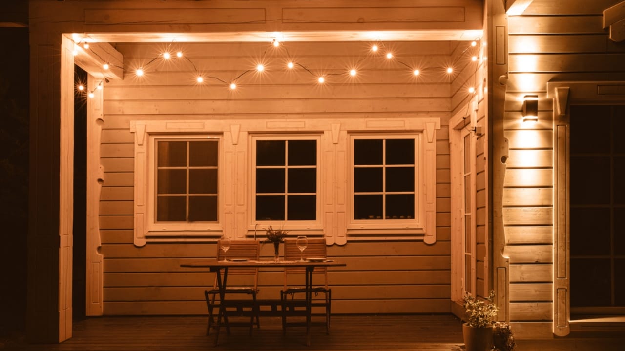 8 Ways to Make Your Porch a Welcoming Outdoor Escape - porch with warm bulbs dp219279280