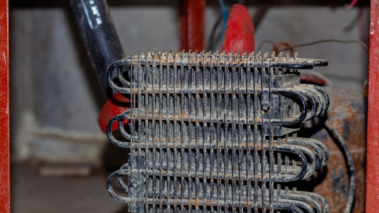 Avoid These 14 Energy Traps Draining Power—and Your Wallet 3 Avoid These 14 Energy Traps Draining Power—and Your Wallet - refrigerator coil ss2516695157