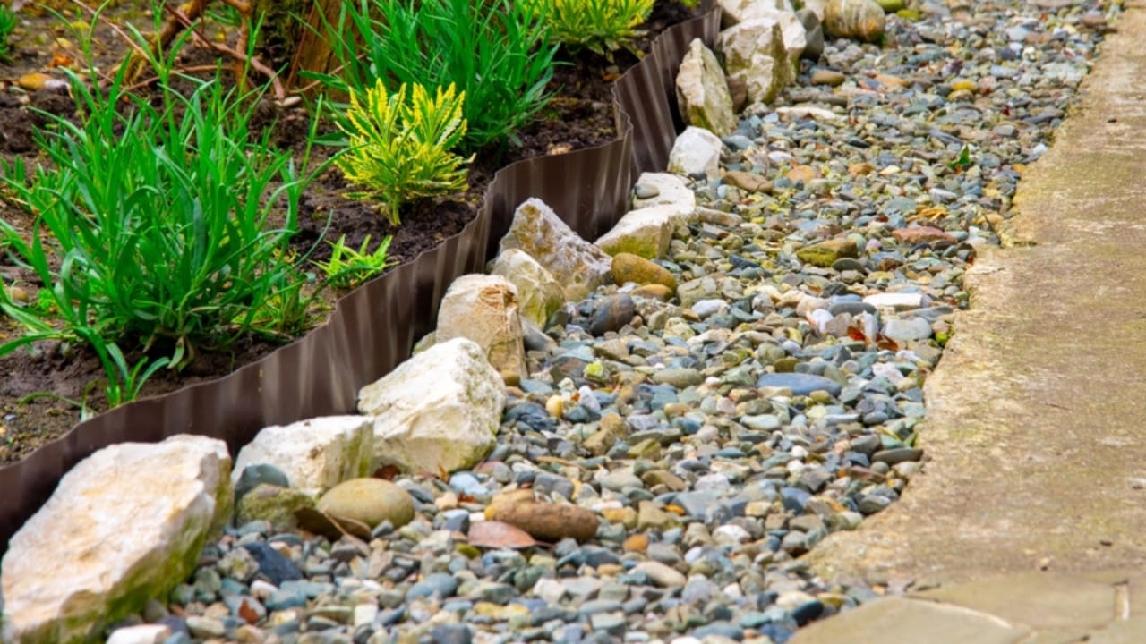 Rock Your Landscape with These 14 Creative Uses for Stones 12 Rock Your Landscape with These 14 Creative Uses for Stones - rock border garden ss2156046879