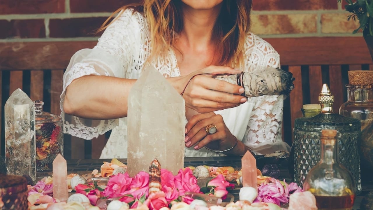 Ancient Ritual Meets Modern Science: Sage Smudging's Impact on Indoor Air Quality - sage with woman ss2239967359