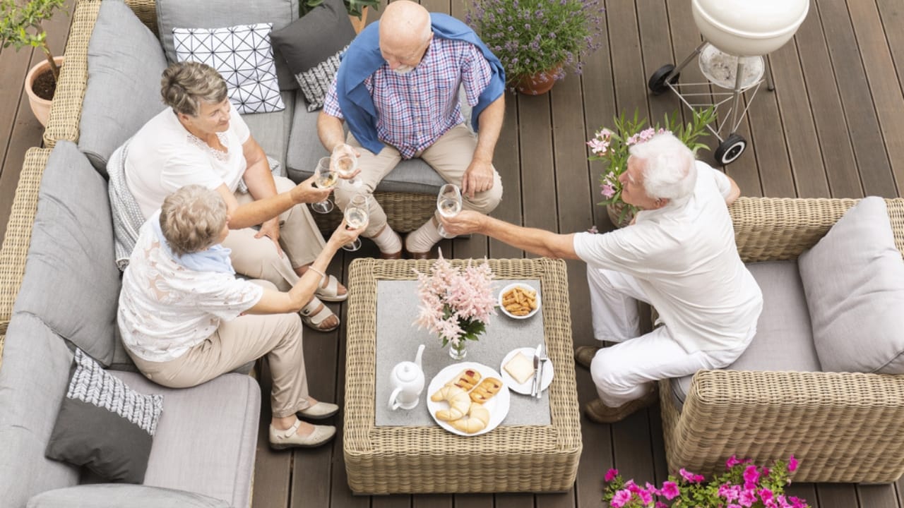 18 Fresh Patio Design Ideas to Elevate Your Outdoor Space in 2024 6 18 Fresh Patio Design Ideas to Elevate Your Outdoor Space in 2024 - senior talking in outdoor patio dp213746884