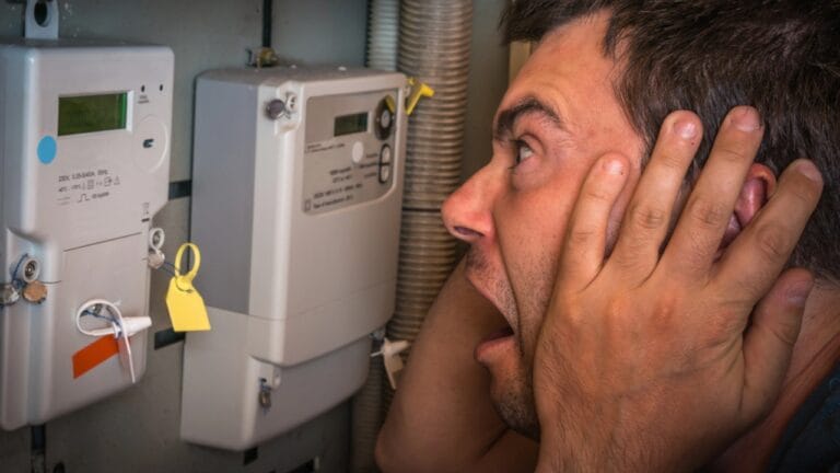 Avoid These 14 Energy Traps Draining Power—and Your Wallet 10 Avoid These 14 Energy Traps Draining Power—and Your Wallet - terrified man dp220075192