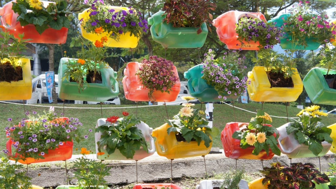 20 Creative Ways to Reuse Plastic Bottles in Your Home, Garden & Crafts - vertical bottle garden dp246872940