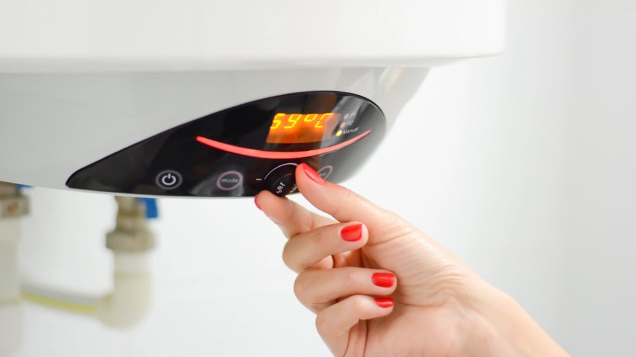 Avoid These 14 Energy Traps Draining Power—and Your Wallet 6 Avoid These 14 Energy Traps Draining Power—and Your Wallet - water heater temperature dp138398296