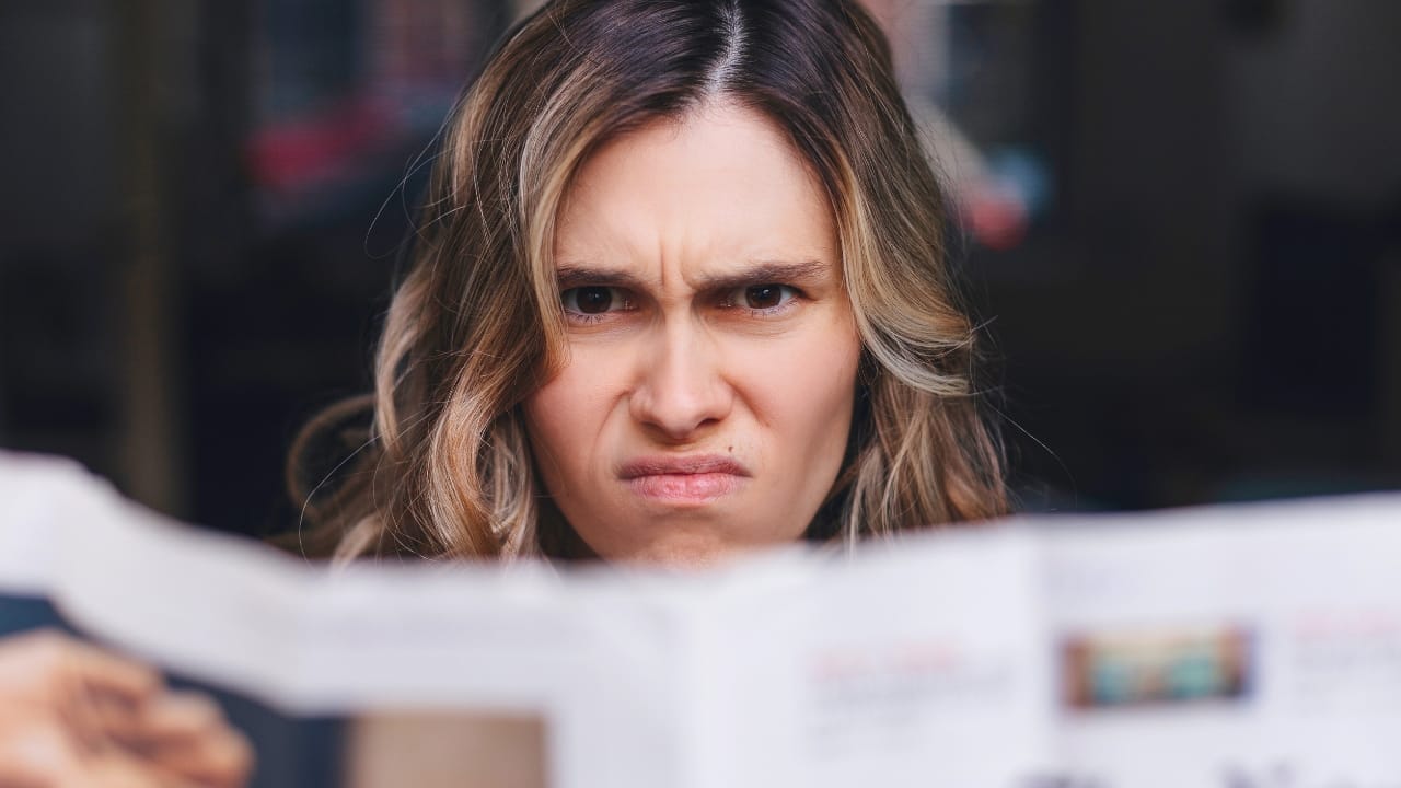 The 15 Donations Thrift Stores Secretly Wish You’d Stop Making 5 The 15 Donations Thrift Stores Secretly Wish You’d Stop Making - woman angry reading ss2162844191