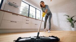 Living Solo? These 15 Cleaning Hacks Will Save You Time & Effort 1 Living Solo? These 15 Cleaning Hacks Will Save You Time & Effort - woman cleaning ss2516114415