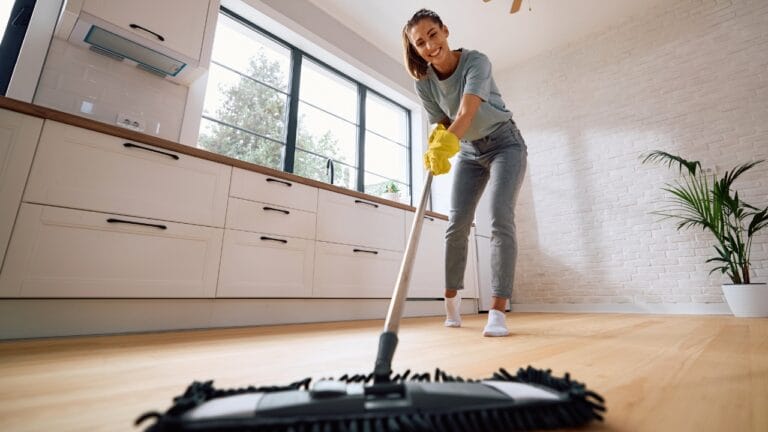 Living Solo? These 15 Cleaning Hacks Will Save You Time & Effort - woman cleaning ss2516114415