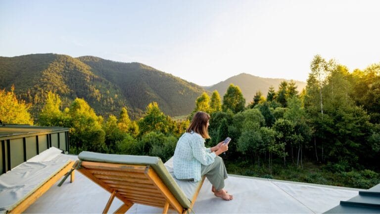 7 Off-Grid Internet Solutions for Staying Connected Anywhere 9 7 Off-Grid Internet Solutions for Staying Connected Anywhere - woman phone nature ss2538979529 degm