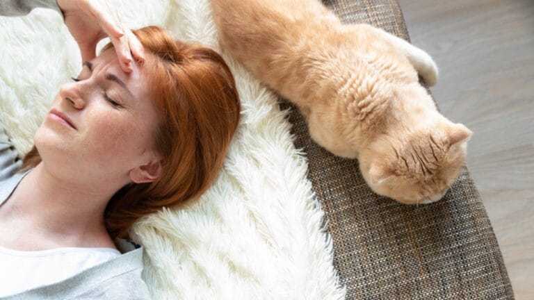 10 Signs That It May Be Time to Let Your Cat Go 8 10 Signs That It May Be Time to Let Your Cat Go - woman cat sleeping ss1756221239