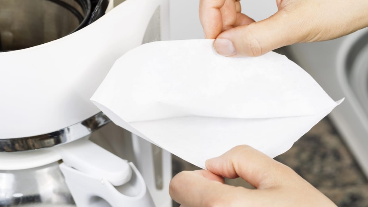 More Than Just for Coffee: 25 Life-Saving Uses for Coffee Filters 8 More Than Just for Coffee: 25 Life-Saving Uses for Coffee Filters - woman holding coffee filter dp32362305