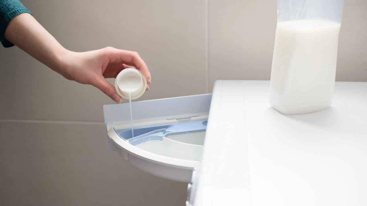 14 Natural Homemade Cleaners You Can Trust for a Chemical-Free Clean 13 14 Natural Homemade Cleaners You Can Trust for a Chemical-Free Clean - woman pouring Fabric Softener dp97083628