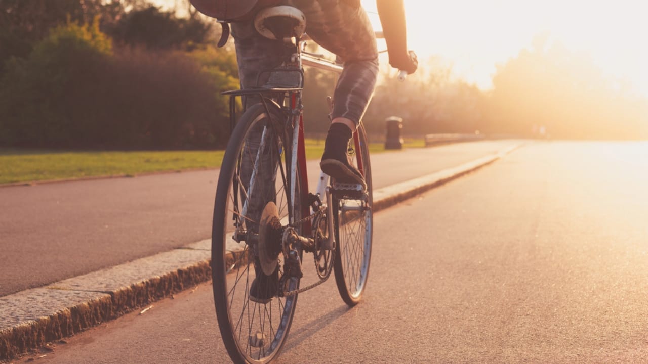 15 Supplies to Help You Survive & Thrive in Case of a Collapse - woman riding bicycle dp42596527