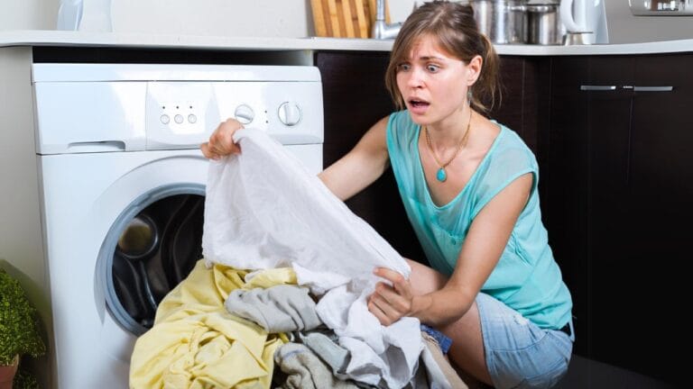 10 Items You’re Probably Washing to Death—and How to Make Them Last Longer 8 10 Items You’re Probably Washing to Death—and How to Make Them Last Longer - woman shocked doing laundry dp85781910