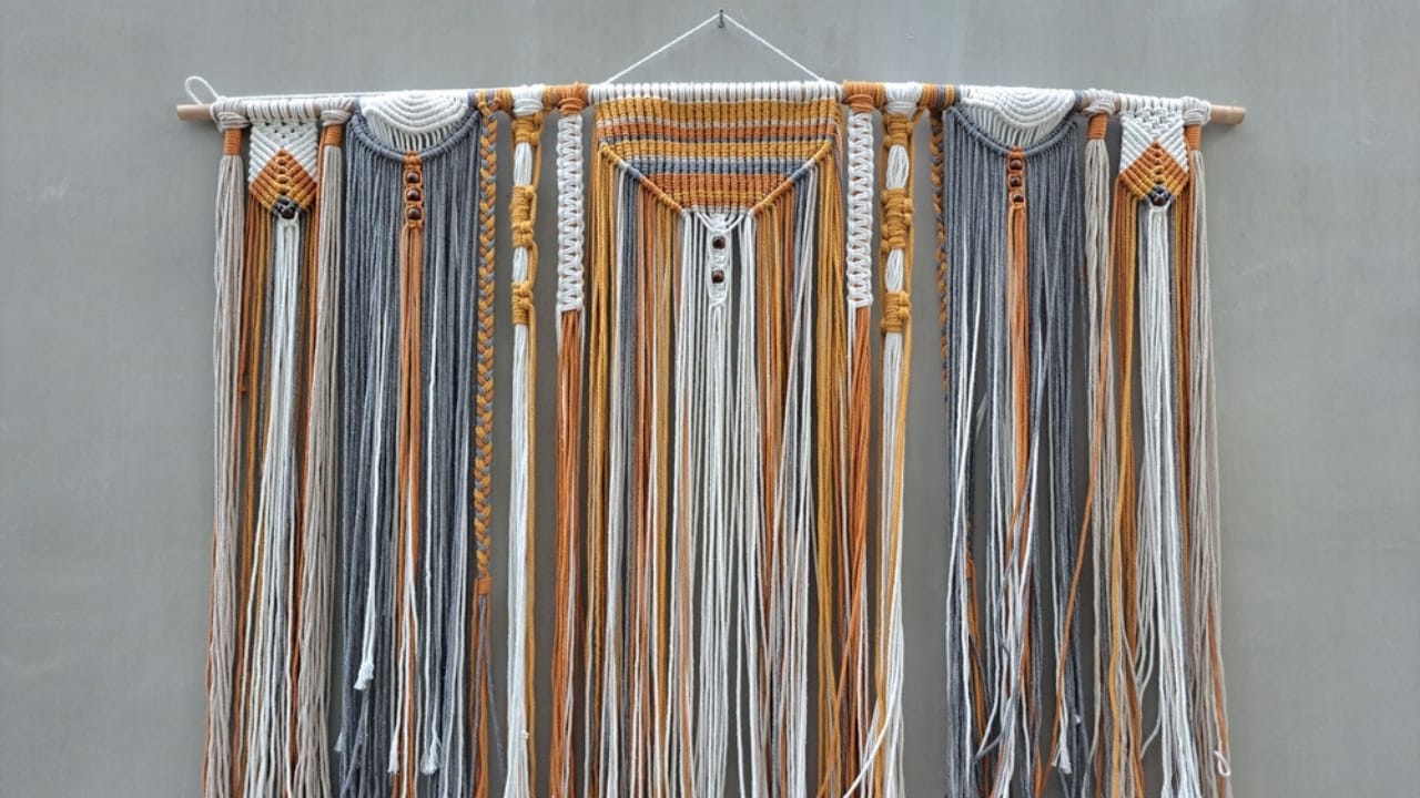 Don’t Toss That Yarn: 15 Creative Uses for Your Leftover Scraps 9 Don’t Toss That Yarn: 15 Creative Uses for Your Leftover Scraps - yarn wall hanging ss2329809969